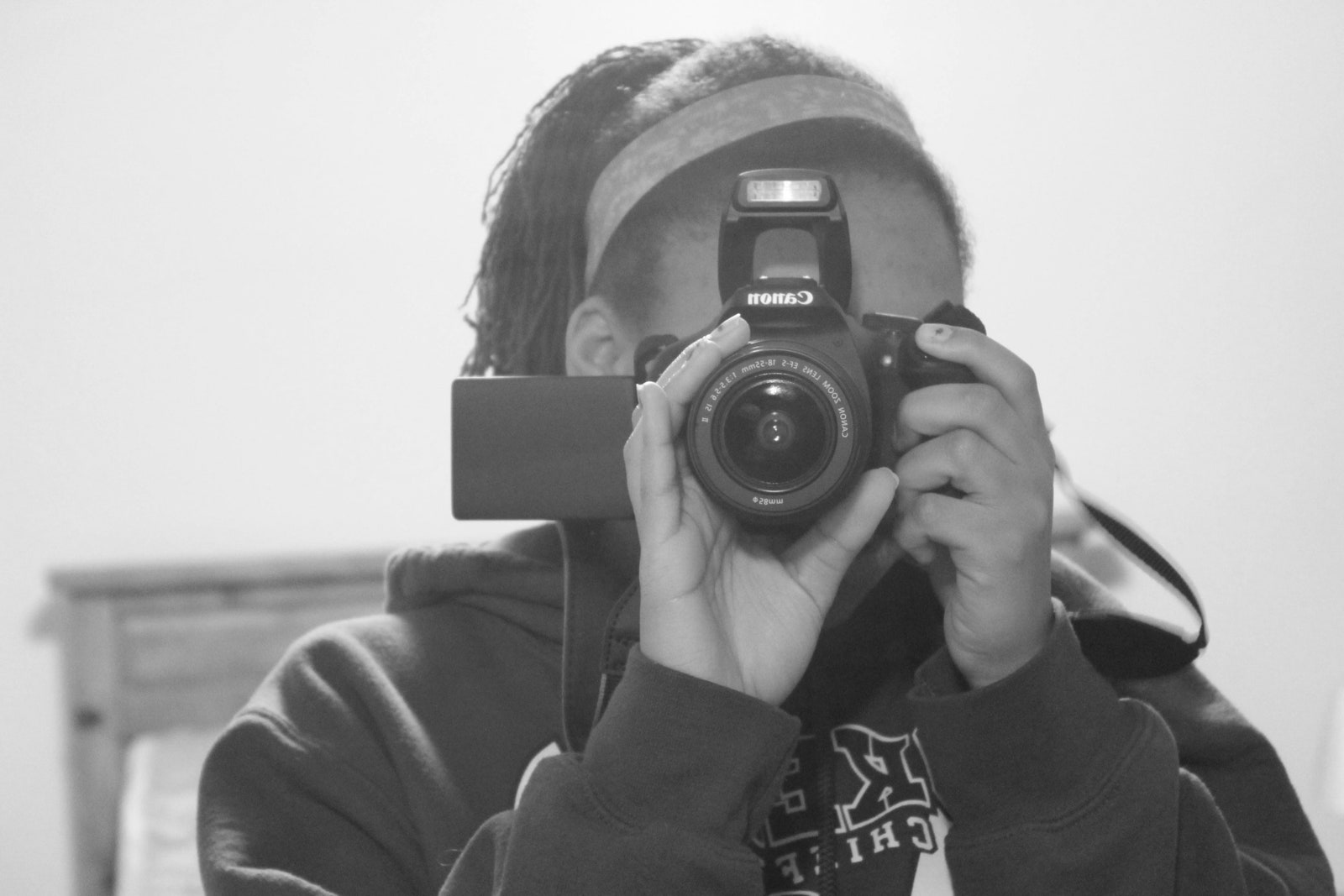 Image may contain Photography Face Head Person Portrait Camera Electronics and Photographer